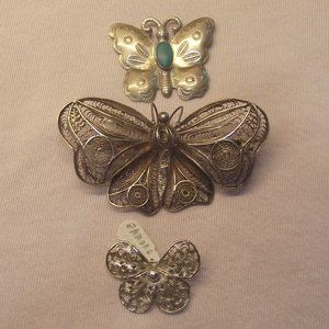 Three silver butterflies